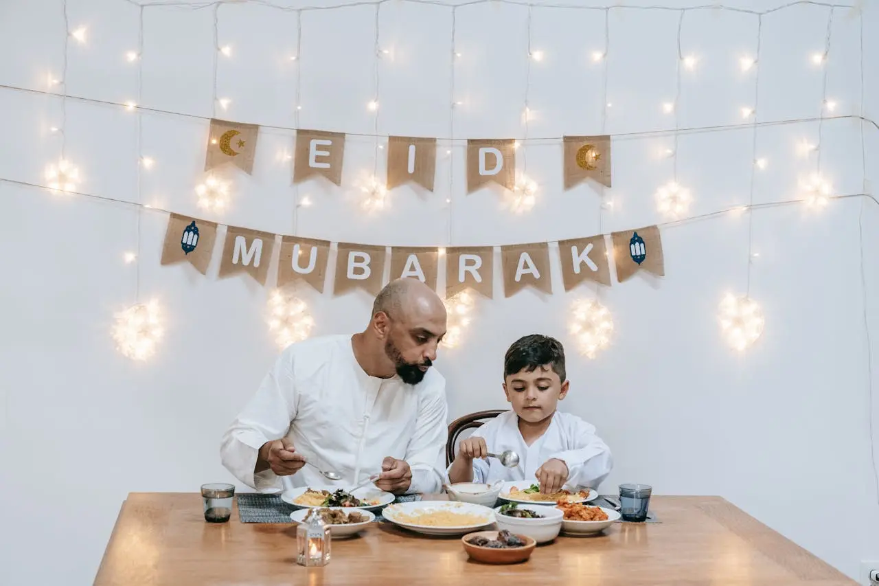 Eid ul Adha 2026 - Father and his son celebrating eid day in traditional muslim dress
