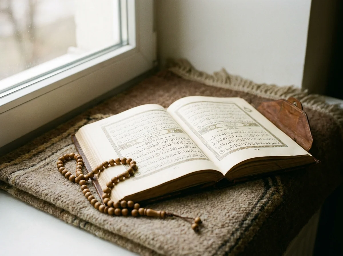 Open Quran with tasbih beads illustrating study of kufr and faith in Islam