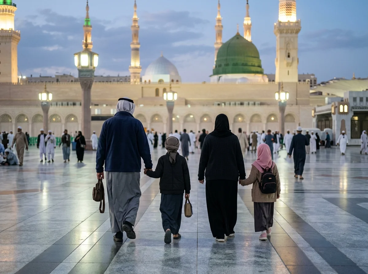Pilgrims in warm winter clothing walking at Masjid an-Nabawi during a December Umrah trip
